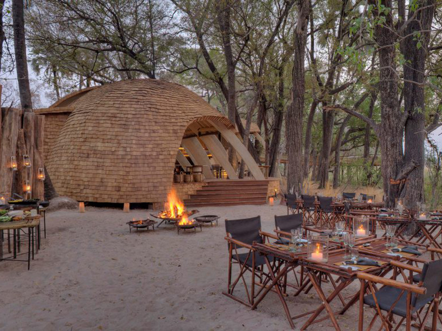 guest-area-with-cosy-fireplace-at-sandibe-on-a-luxury-botswana-safari-overlooking-the-okavango-delta-1024x576